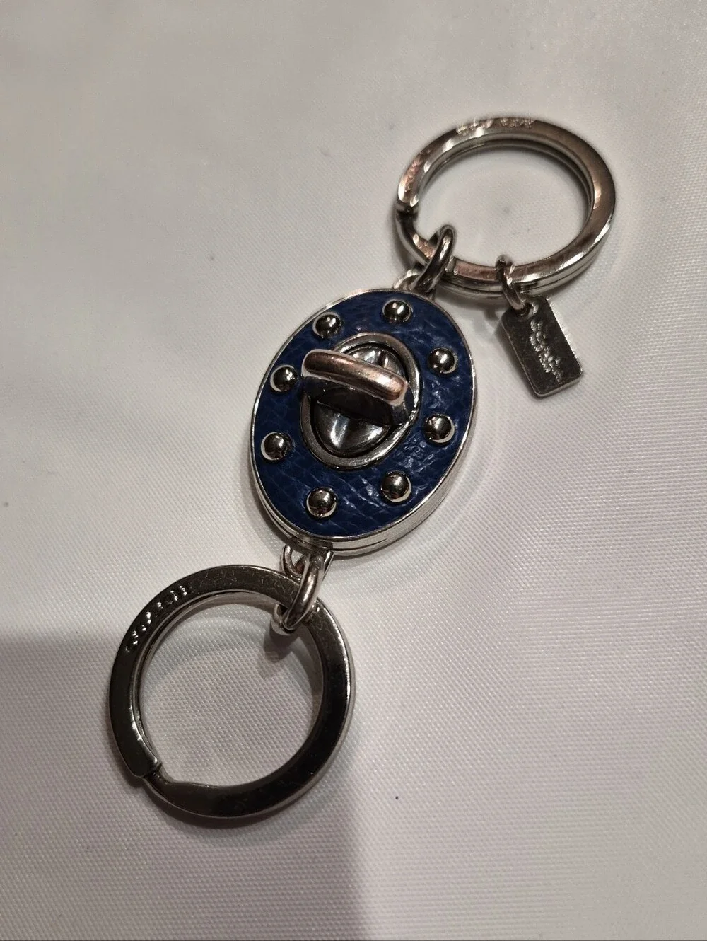 Coach Studded Leather Turnlock Keychain